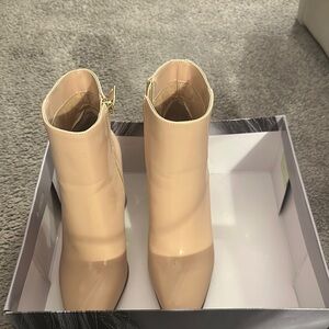 Jennifer Lopez Cream Ankle Booties with Modern Silhouette